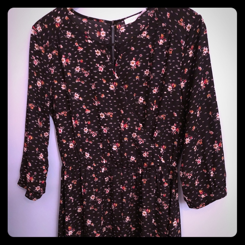 Floral dress / tunic length. Black background.